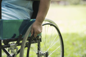 Close up Lonely elderly woman sitting on wheelchair at garden in hospital